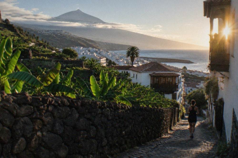 A view over Puerto de la Cruz rooftops towards the Atlantic with Mount Teide rising in the distance