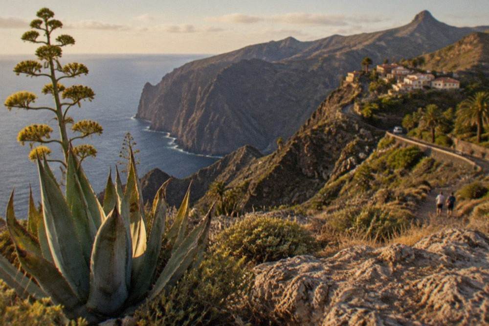 A volcanic landscape of pale rock formations under a wide sky in the hills of Tenerife