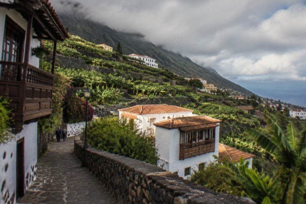 Houses climbing the green hillsides of northern Tenerife near La Orotava
