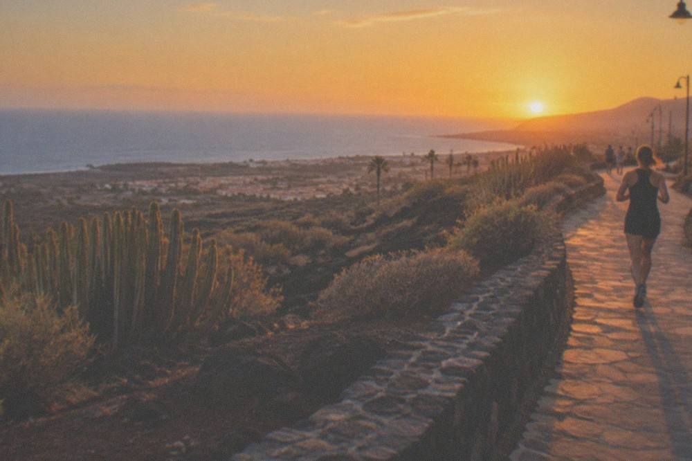 Sunset over the sea from a coastal promenade in south Tenerife