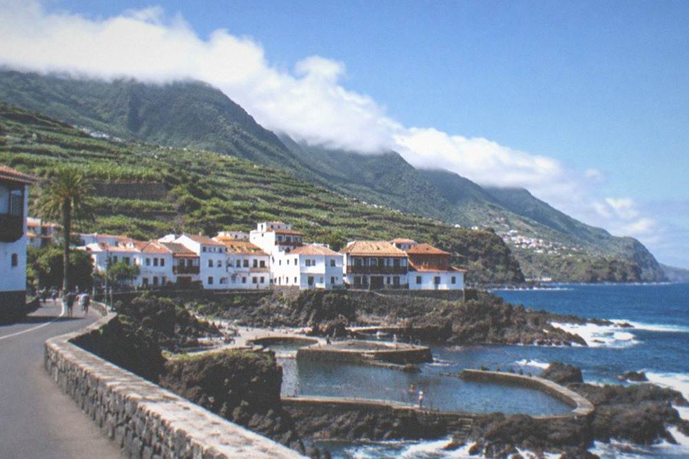 The coastal town of Garachico seen from the road, with natural pools along the shoreline
