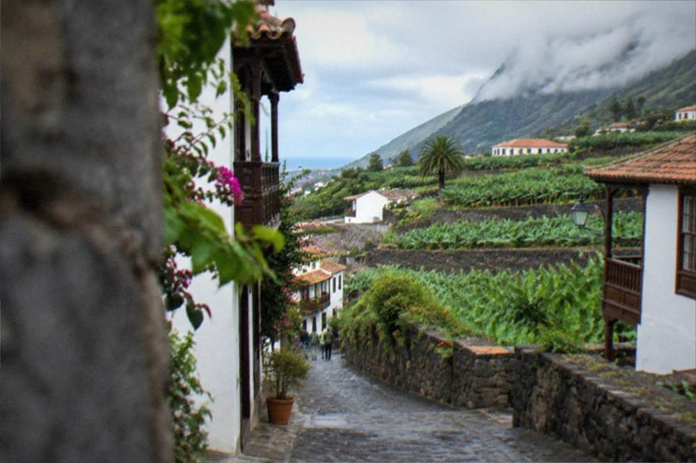 Clouds resting on green hillsides above the north coast of Tenerife
