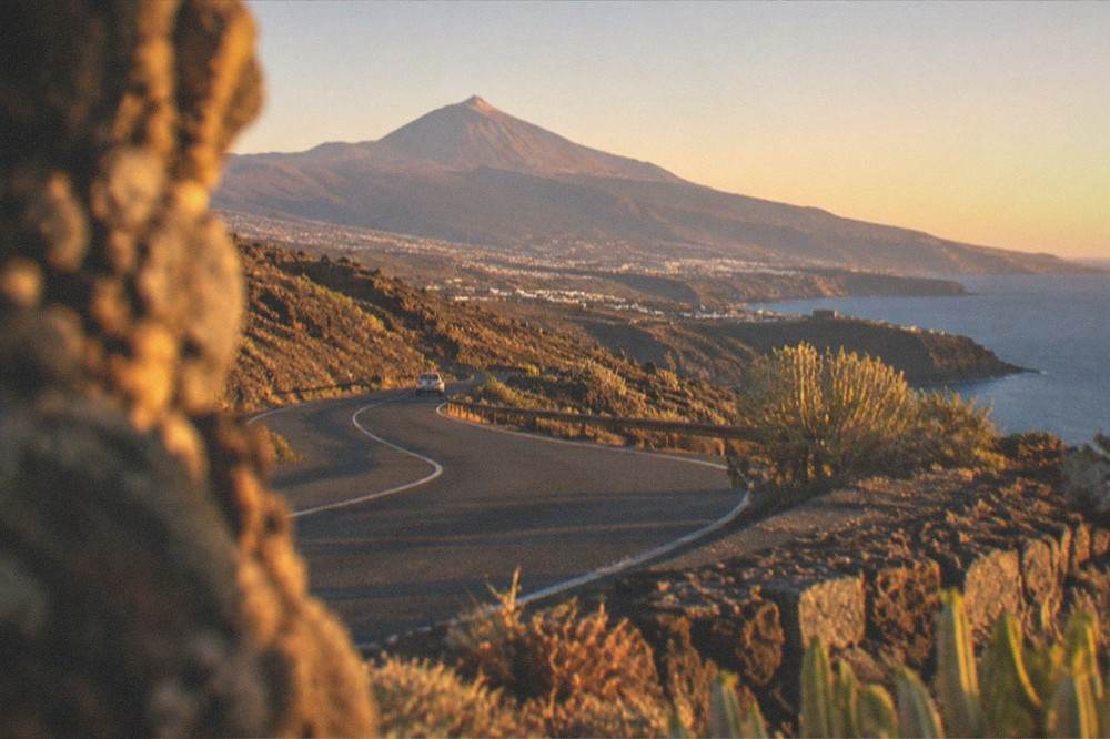 A winding road through volcanic landscape towards Mount Teide