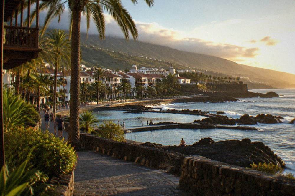 Palm-lined promenade and seawater pools along the Puerto de la Cruz waterfront