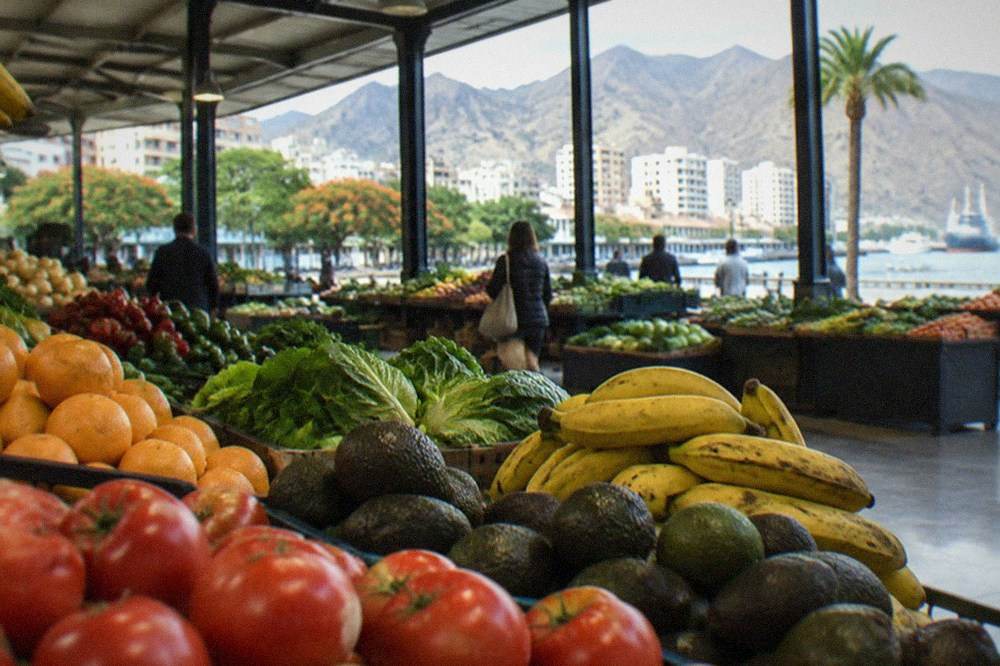 Market stall with fruit and vegetables under a covered hall in Santa Cruz