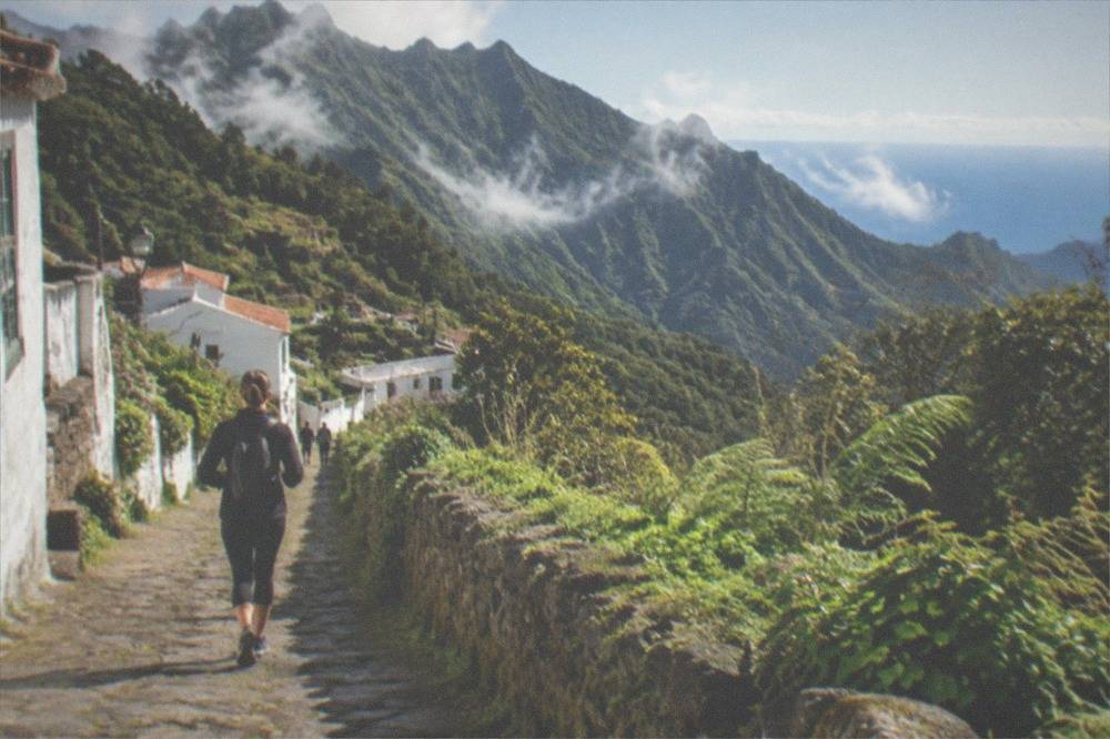 A small whitewashed village on a green slope in the Anaga mountains