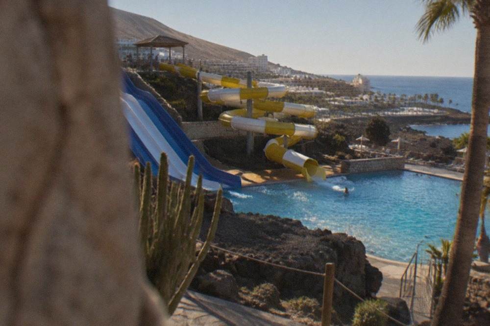 Water park slides and pools under a sunny sky in Costa Adeje, Tenerife