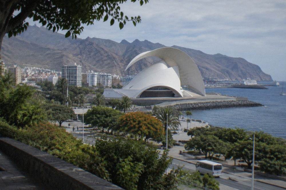 The white curved roof of the Auditorio de Tenerife beside the sea in Santa Cruz