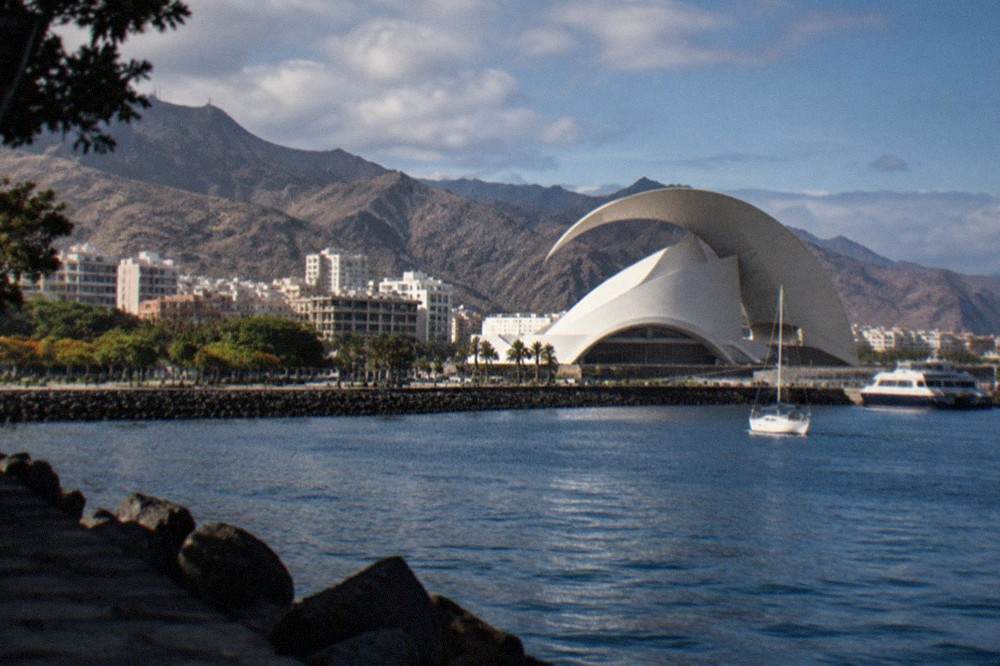 The concert hall seen from the water with its arching roofline