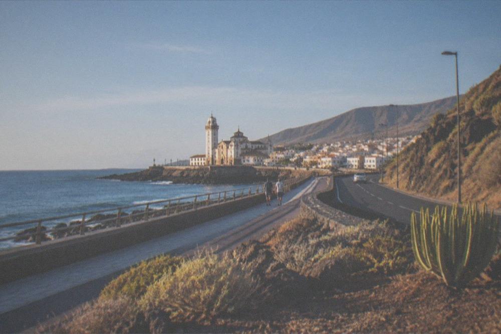 The coastal road and seafront at Candelaria with the basilica in the distance
