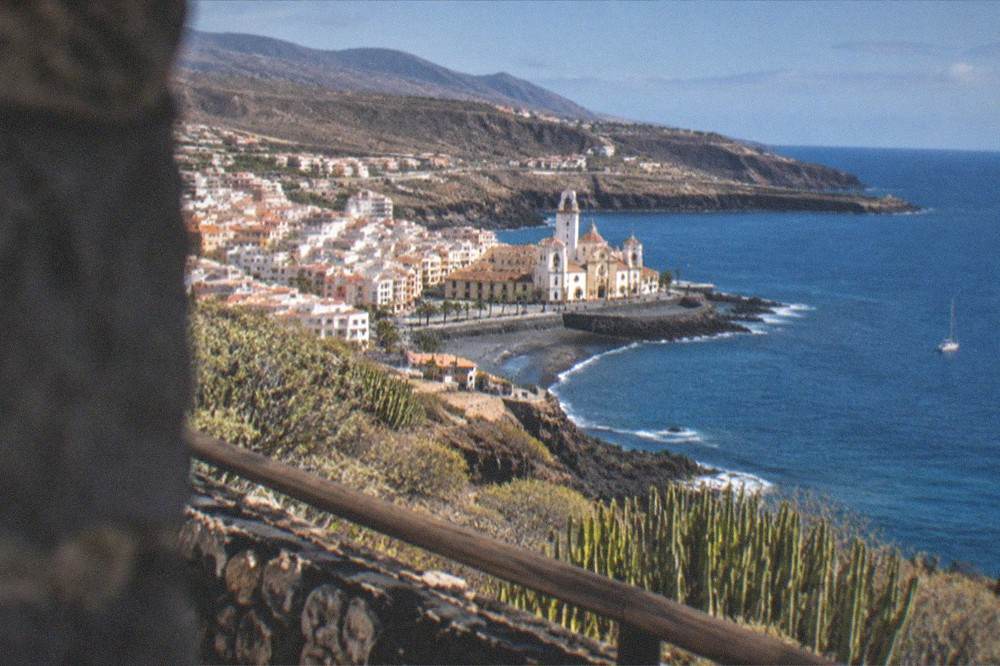 A coastal view of Candelaria town from a nearby viewpoint