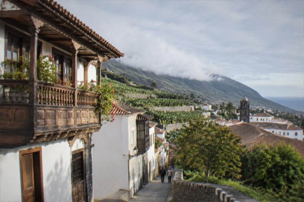 Sunlight on carved wooden balconies of a historic house in La Orotava