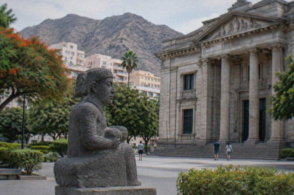 The neoclassical stone facade of the Museum of Nature and Archaeology in Santa Cruz de Tenerife under a bright sky