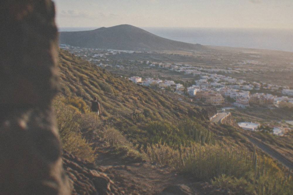 The town of Güímar spread below green slopes under evening light
