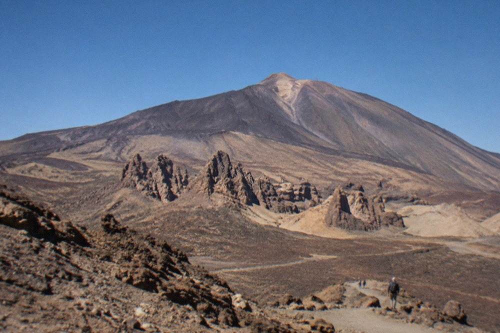Mount Teide rising above the volcanic slopes of Teide National Park under a clear sky