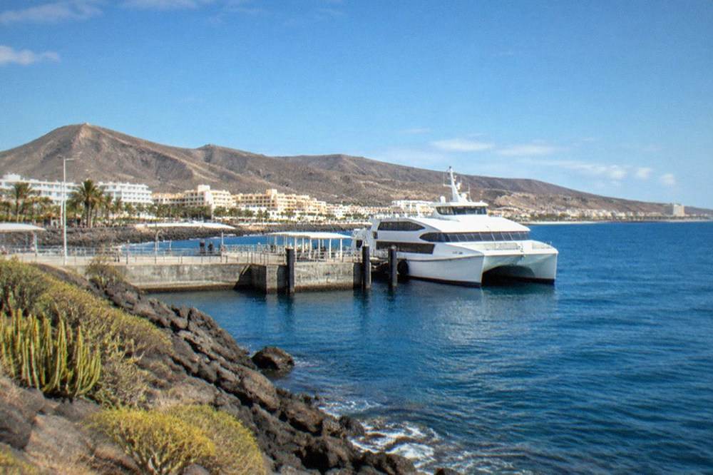 The ferry terminal at Los Cristianos with a catamaran moored alongside