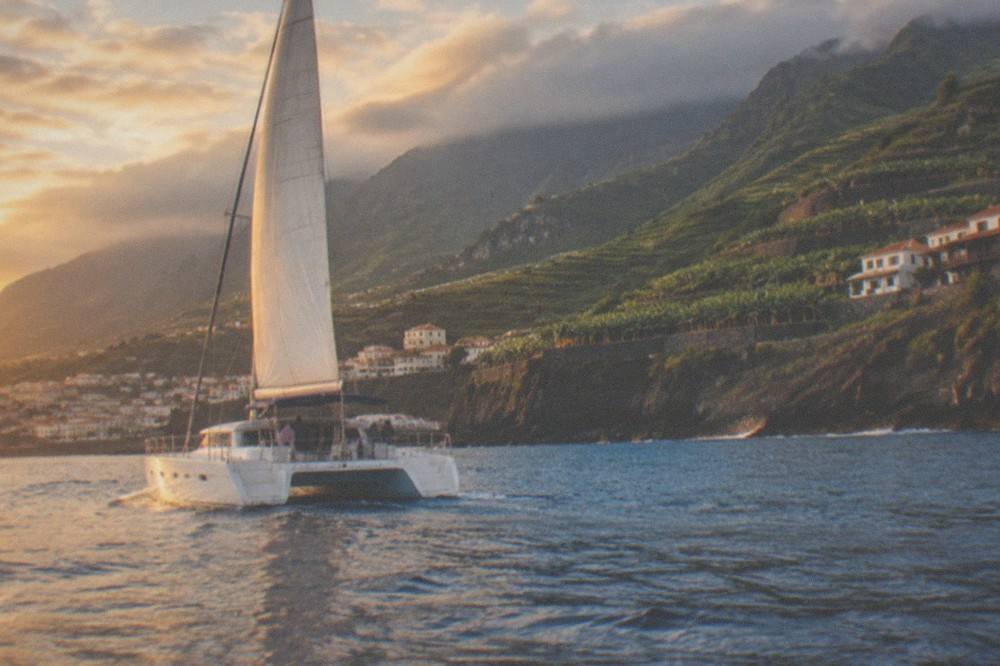 A catamaran under way on calm water off the south coast of Tenerife