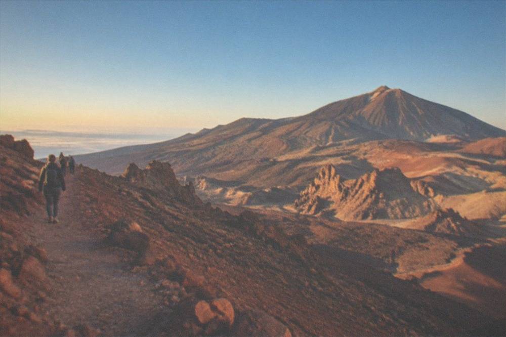 The marked summit trail across red volcanic rock above La Rambleta