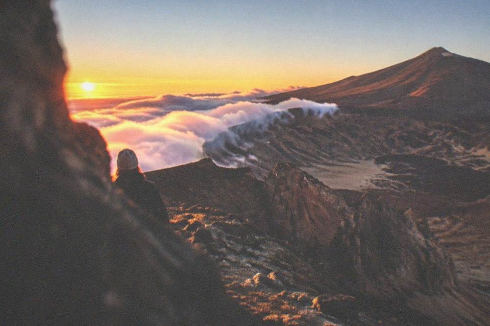 Cloud pouring over the crater rim of Teide at sunset