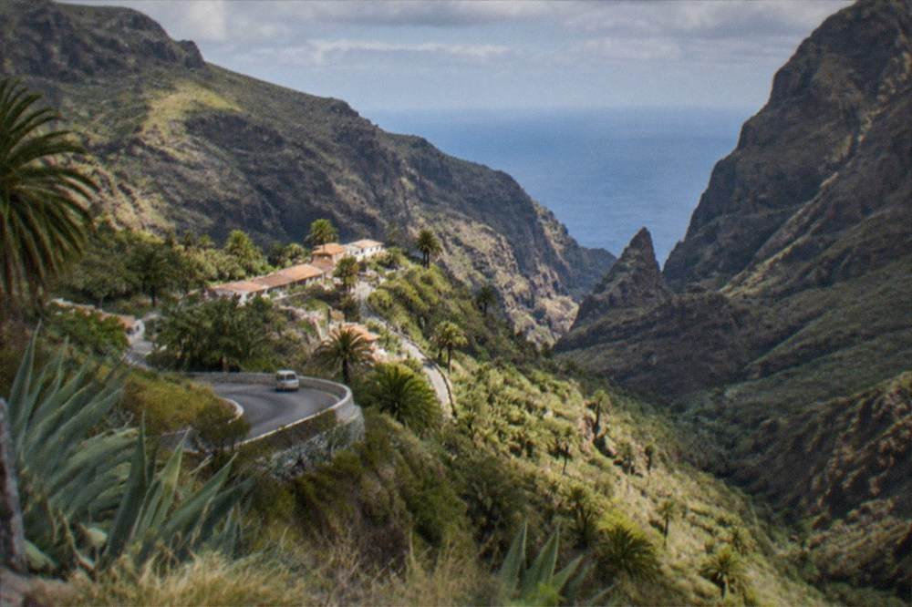 The village of Masca nestled in its gorge with the sea in the distance