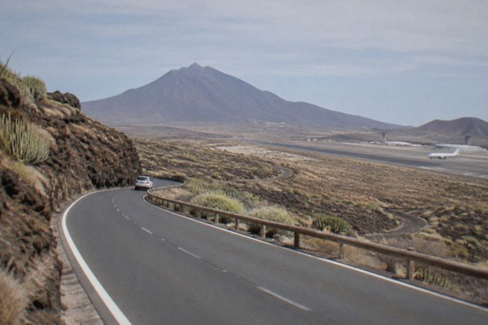 A road winding through volcanic scenery on the island of Tenerife