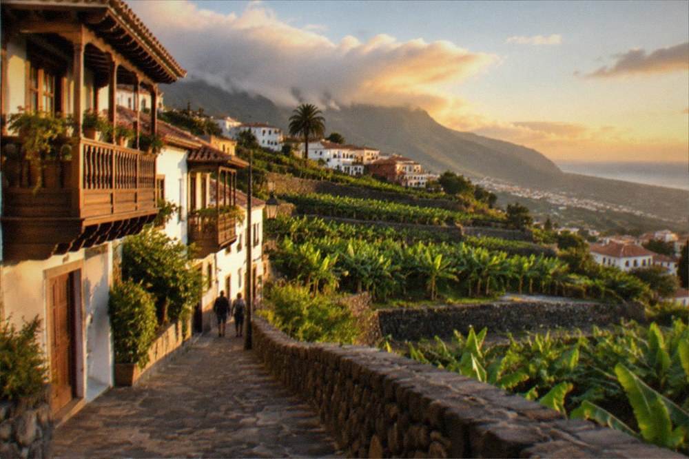 A lush terraced hillside town in northern Tenerife with traditional balconied houses