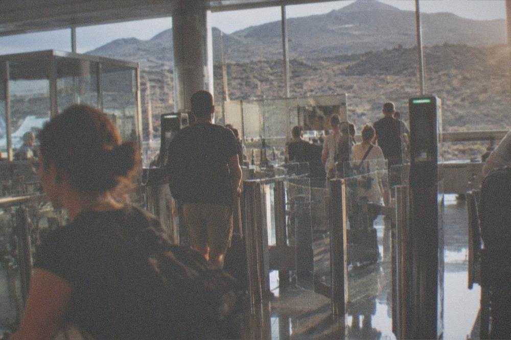 Passport control booths in an airport arrivals hall with electronic gates