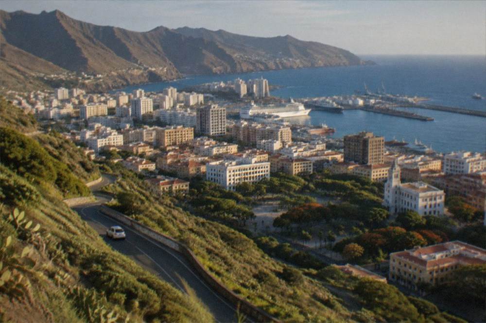 A viewpoint over green mountains and a winding road in northern Tenerife