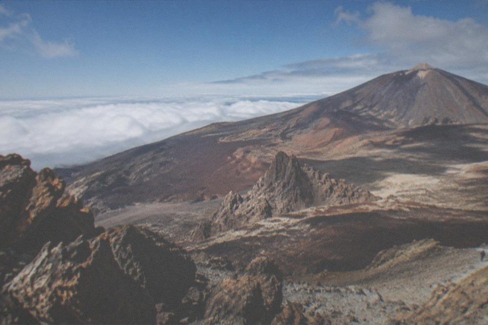 Panoramic view from high on Teide across the clouds covering the island below