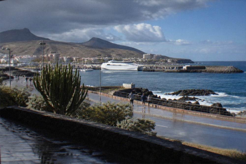 Rain clouds over a Canary Island port town with wet streets