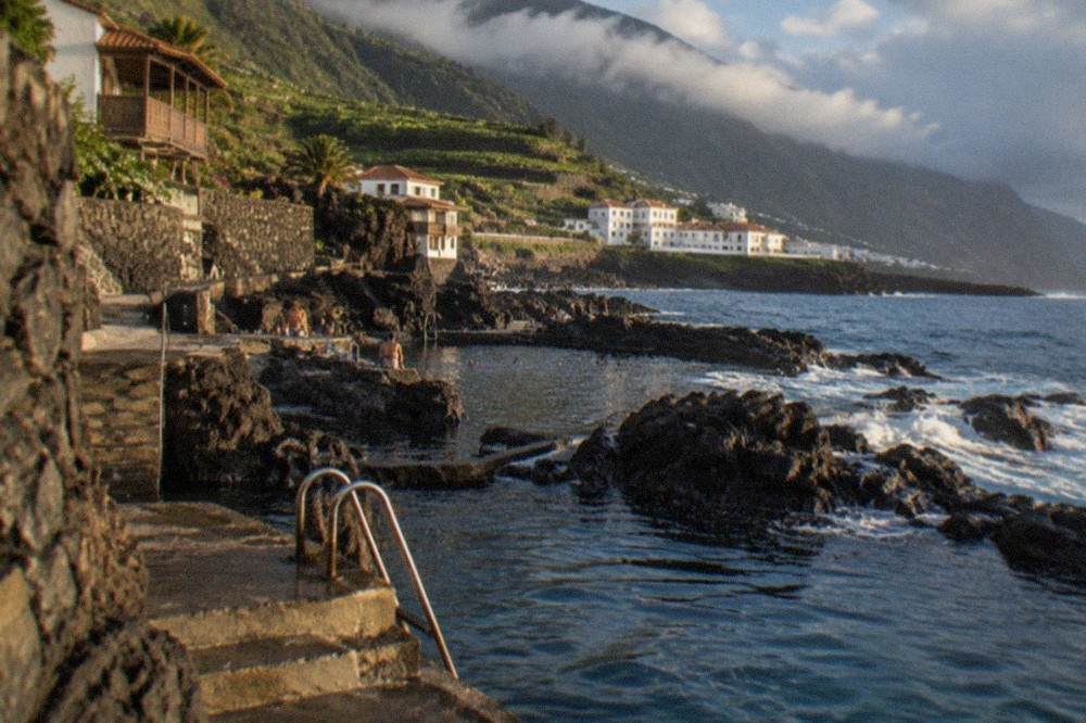 Basalt rock pools with ladders and steps at a coastal swimming spot