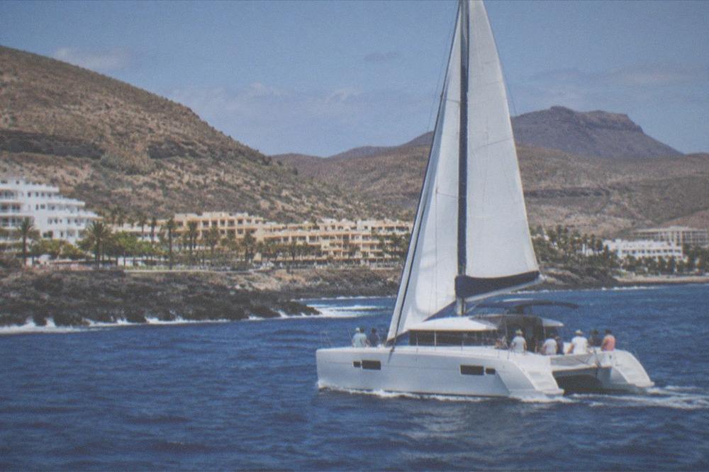 A catamaran with passengers on the open sea off Puerto Colon