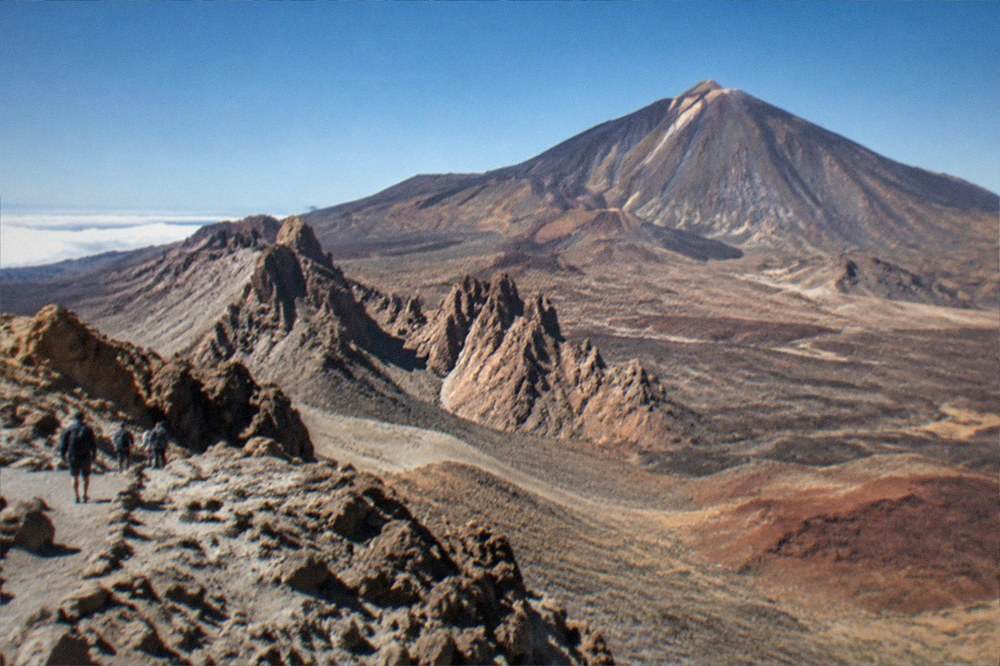 A viewpoint over the volcanic landscape of Teide National Park under a clear sky
