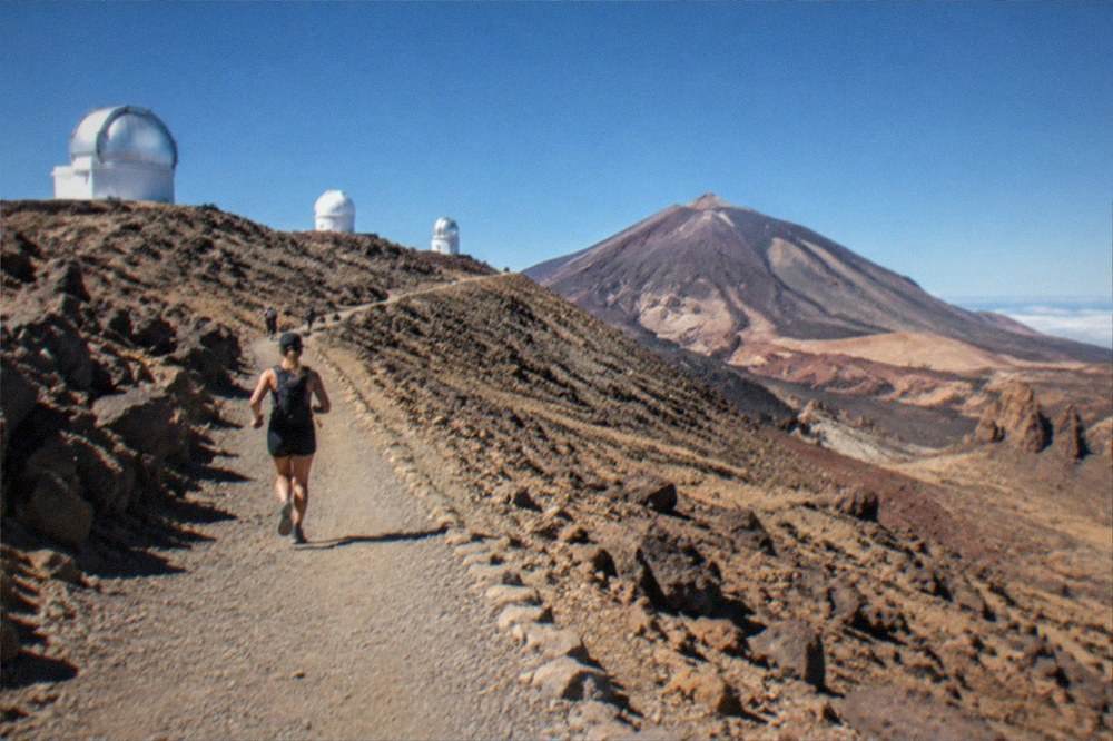 The Teide Observatory domes on the Izana ridge under a deep blue sky