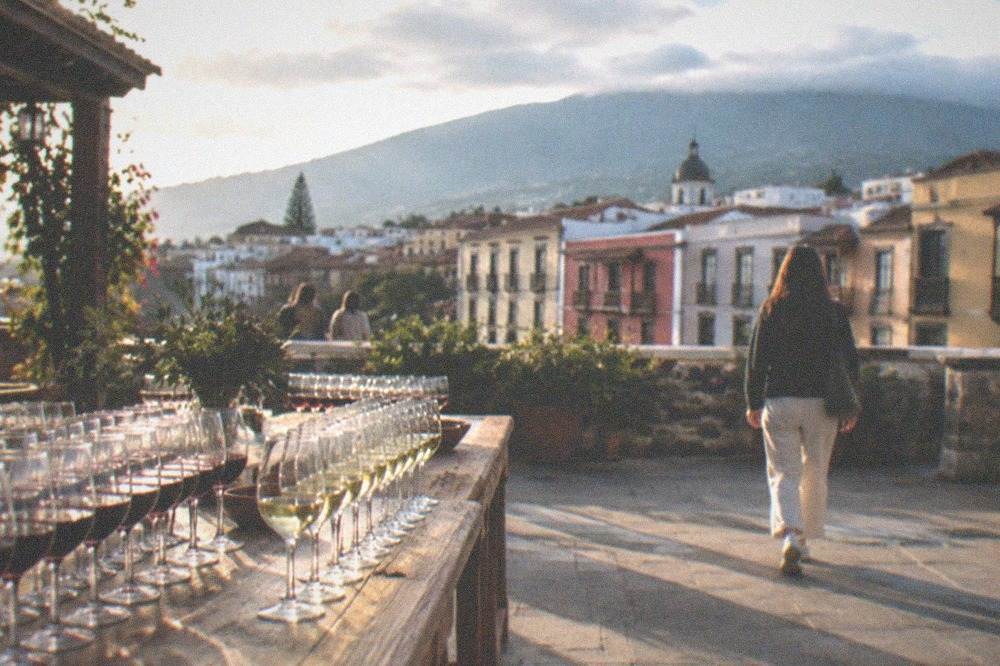 A winery terrace with rows of glasses of red and white wine
