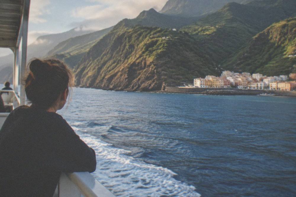 A ferry crossing calm blue water between Tenerife and the island of La Gomera