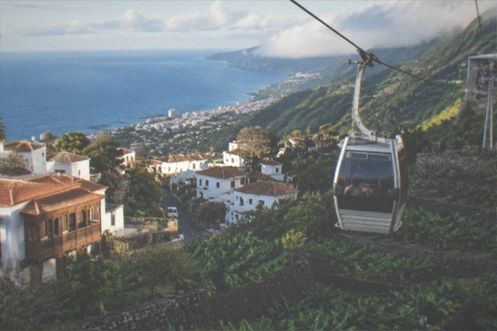A cable car cabin ascending the volcanic slope toward the upper station on Teide