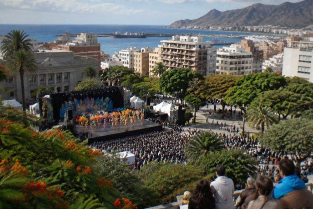 A crowd watching an outdoor Carnival performance in Santa Cruz de Tenerife