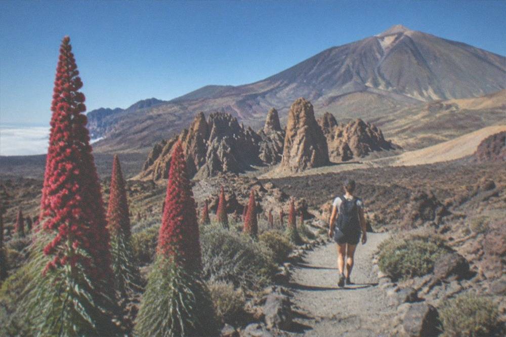 Volcanic rock formations under a deep blue sky in Teide National Park