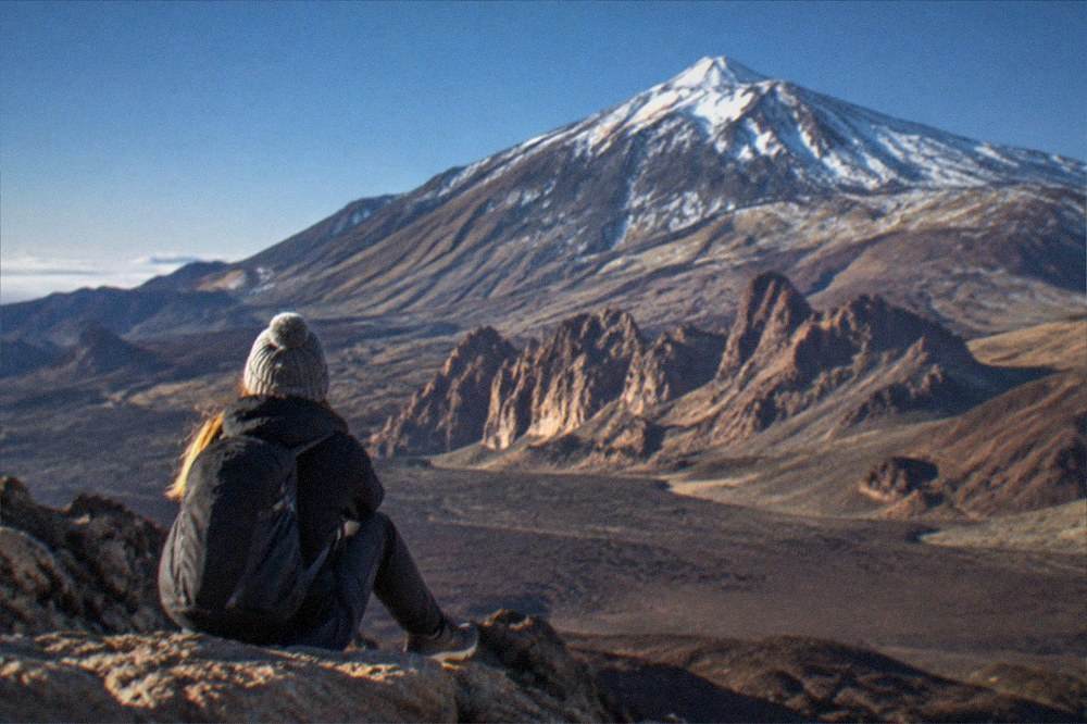The volcanic slopes of Mount Teide in cold clear air with patches of snow on the high ground