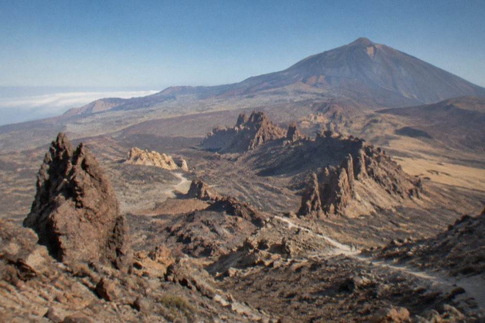 A view over the volcanic rock formations of Teide National Park in soft afternoon light