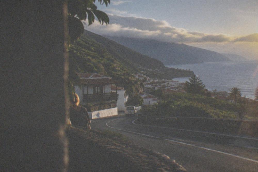 The coastal road into Puerto de la Cruz, green hills either side