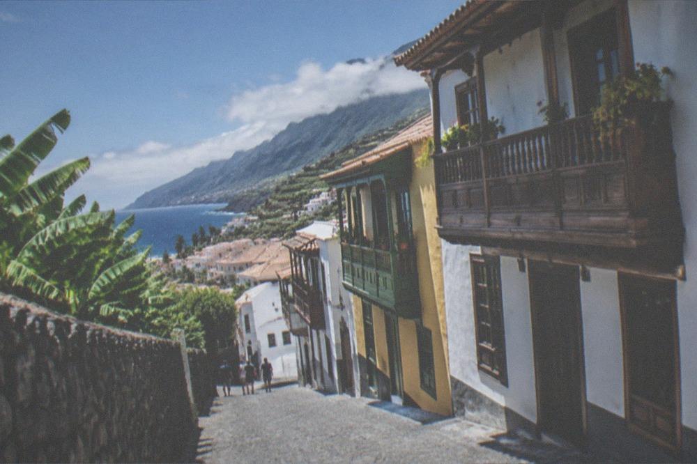 Cobbled street with colourful colonial balconies in a Canary Islands town
