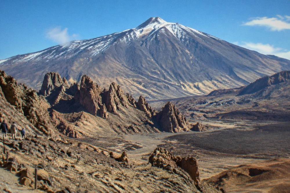 Snow dusting the upper slopes of Mount Teide under a clear winter sky