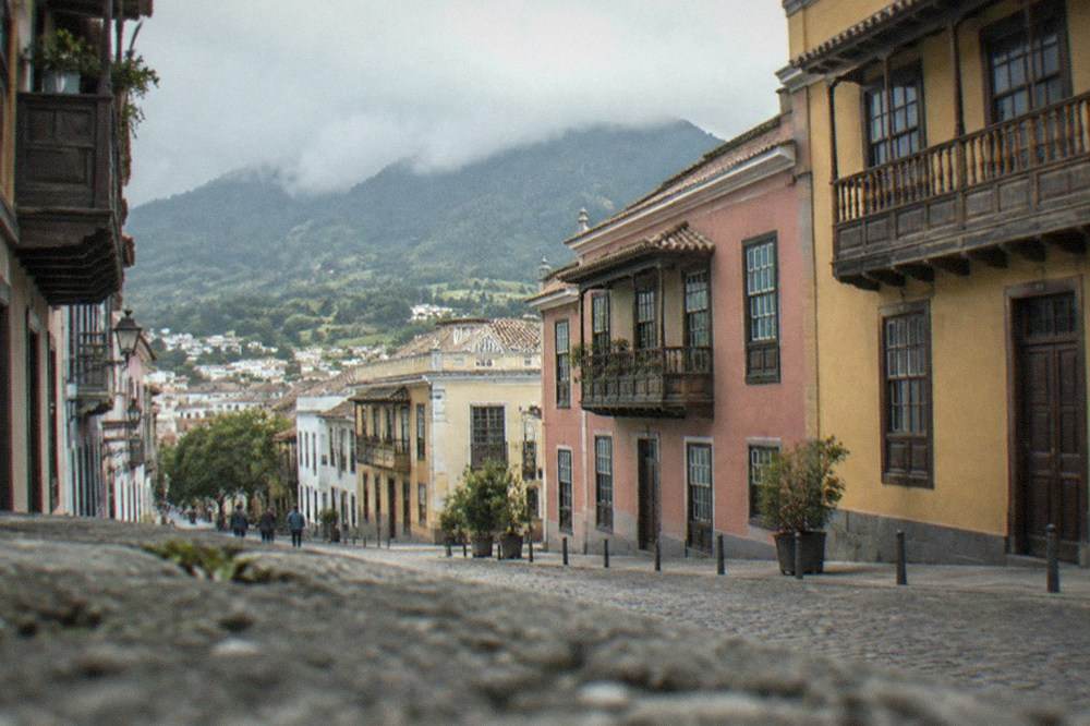 Clouds resting over green mountains near La Laguna in northern Tenerife