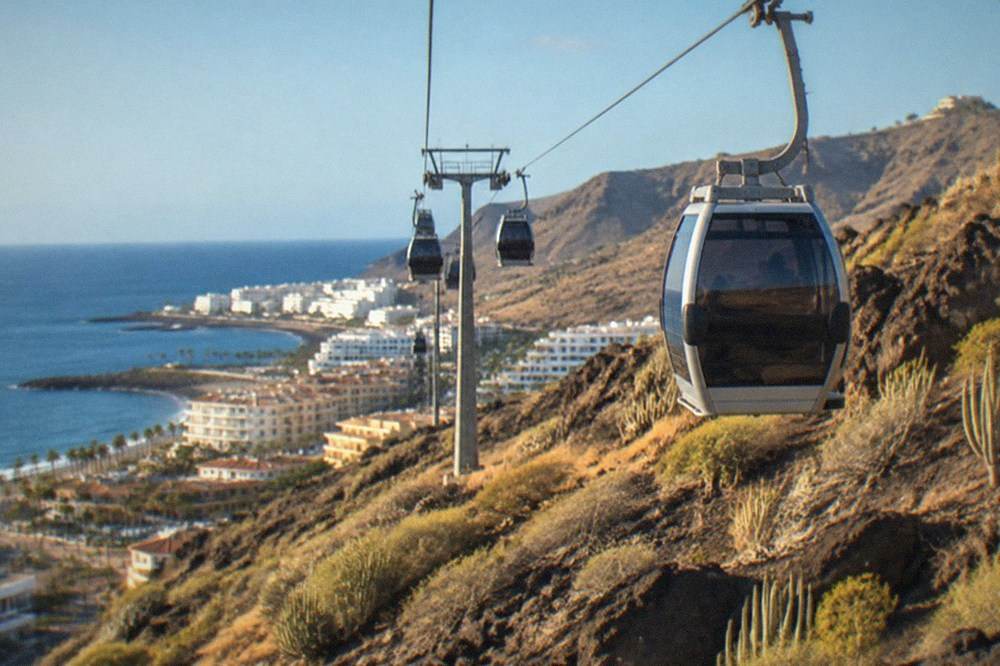 Cable car cabins travelling up the steep slope towards La Rambleta station