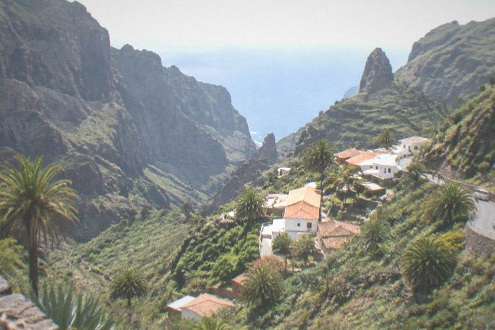 A small whitewashed village of Masca nestled among deep green ravines