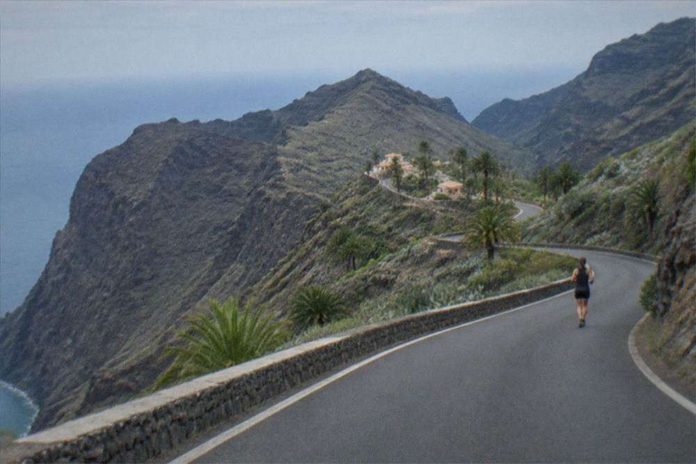 A winding mountain road at Teno Alto with views down to the sea far below