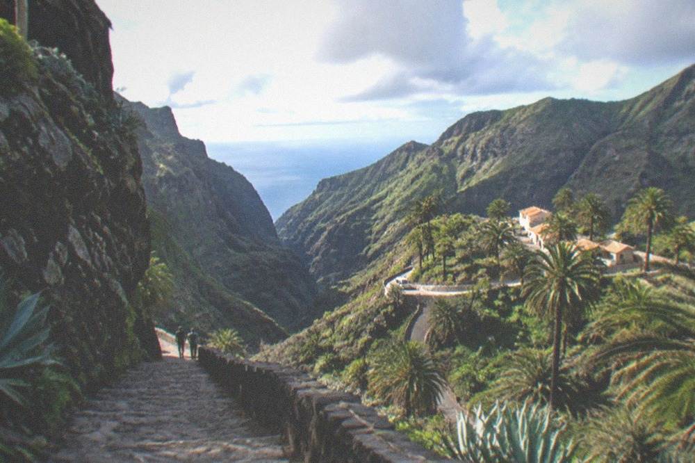 The narrow rocky Masca ravine descending between green cliffs, the sea a distant sliver far below