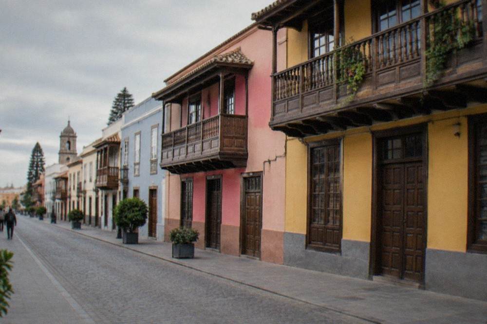 Colourful colonial houses with wooden balconies along a street in La Laguna old town